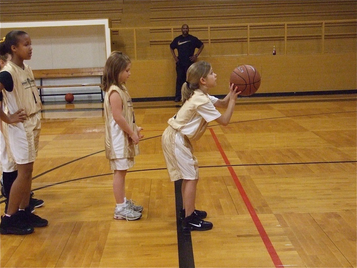 Image: Paige prepares — Paige Henderson(1) gets set to shoot her pre-game free throw.