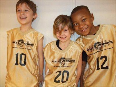Image: Having a ball — Xander Galvan(10), Jacee Coffman(20) and Zorian Burley(12) were having a ball during their game.