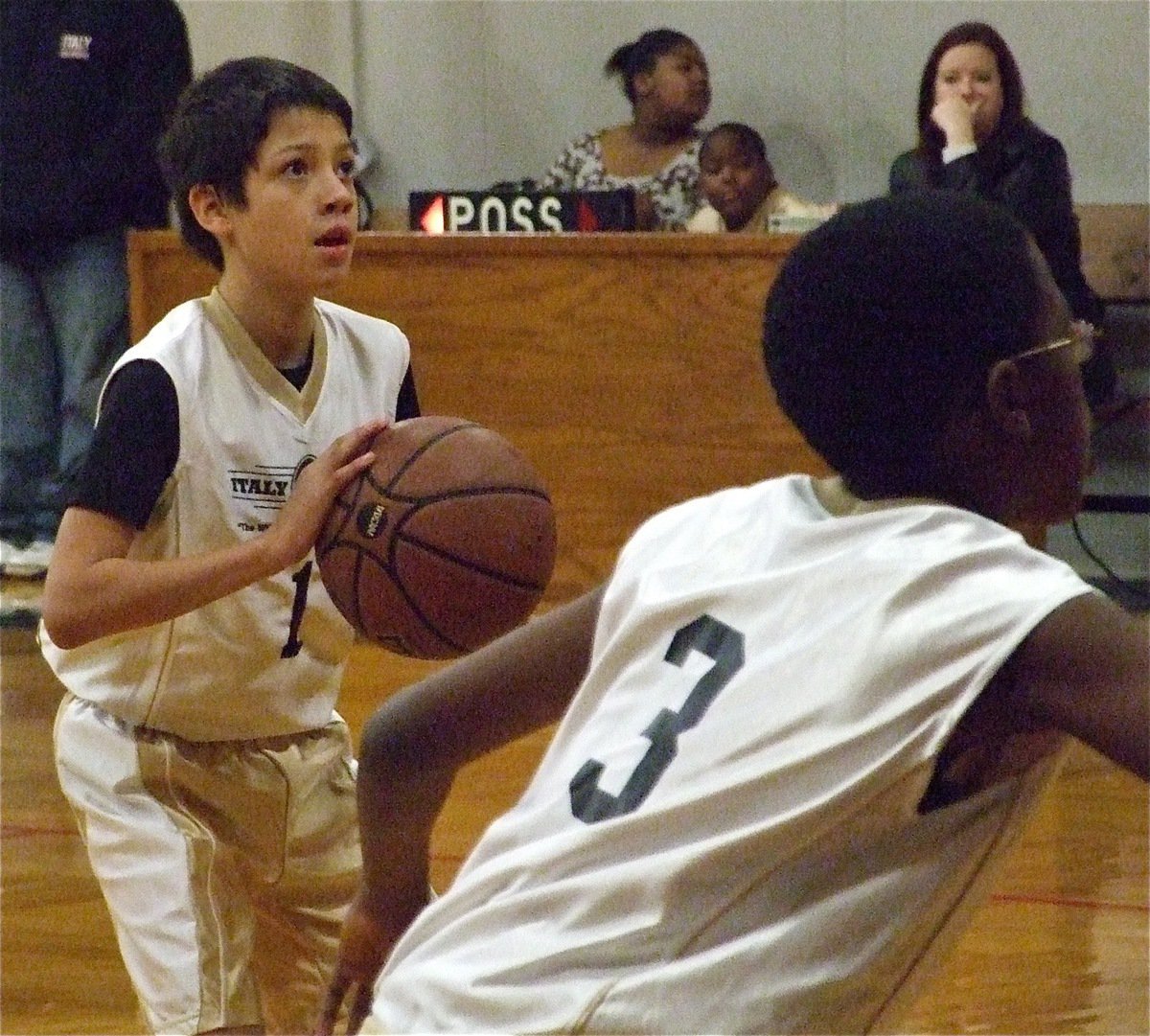 Image: Daren eyes the goal — Daren Cisneros(1) tries his hand at the free throw line as Michael Wilson(3) prepares to rebound.