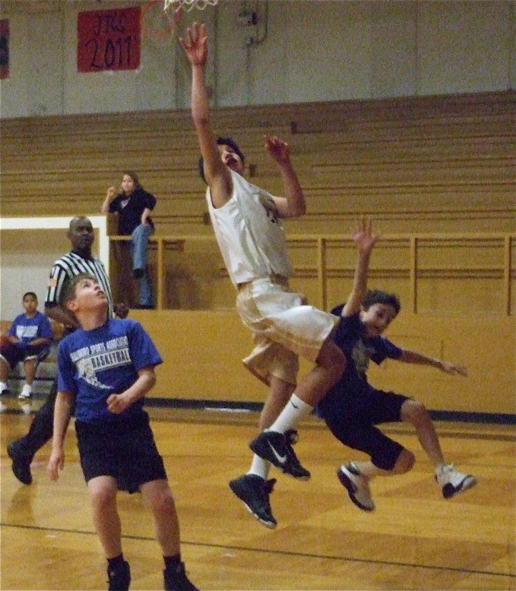 Image: In transition — Joseph Celis(23) is playing in just his 4th basketball game ever but is already made the transition from rookie to superstar.