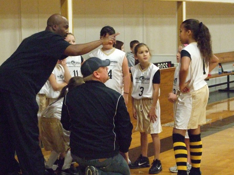 Image: Coaching the girls — Derrick Cunningham and Allen Richards point their 3rd &amp; 4th grade girls toward a 27-16 victory against Hillsboro Black on Saturday.