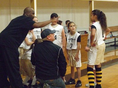 Image: Coaching the girls — Derrick Cunningham and Allen Richards point their 3rd &amp; 4th grade girls toward a 27-16 victory against Hillsboro Black on Saturday.