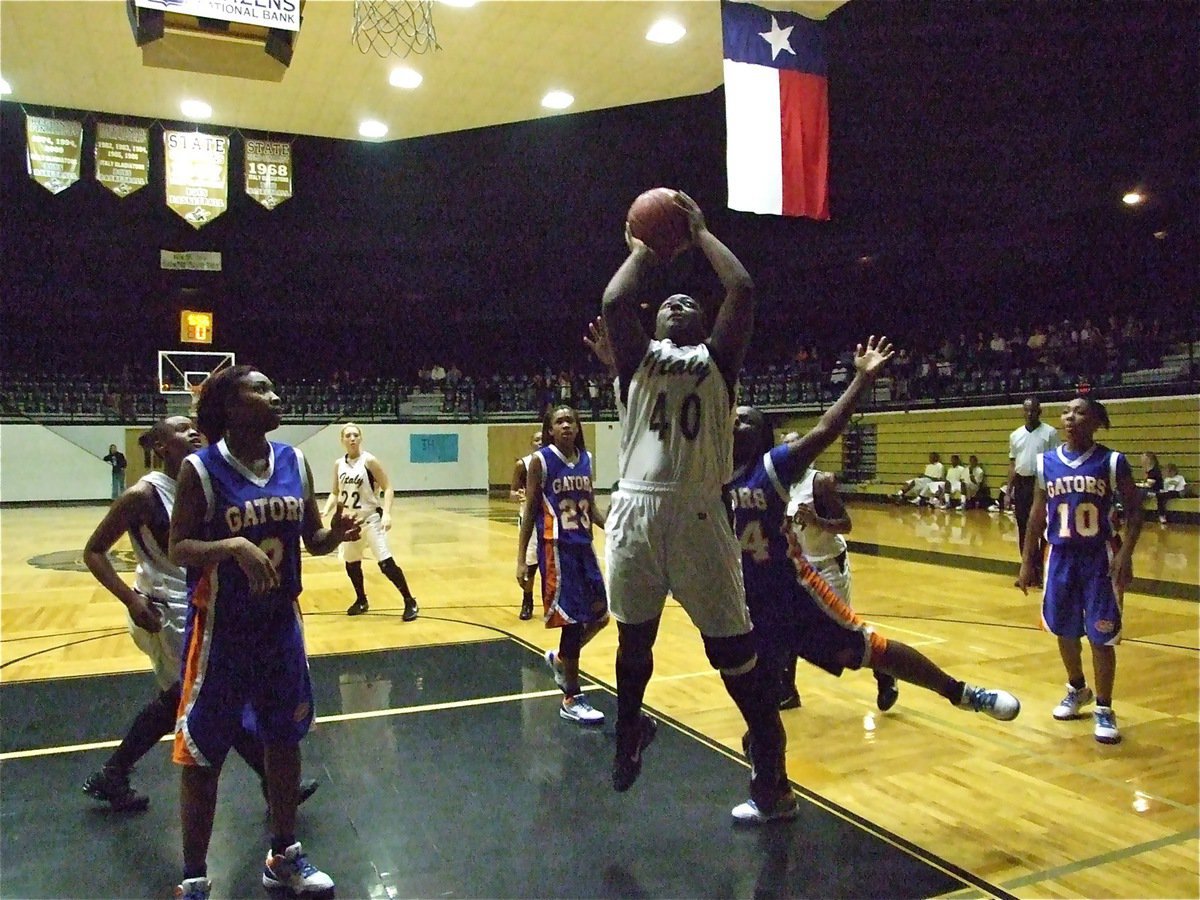 Image: Reed owns the paint — Jimesha Reed(40) scores the bucket and gets the and-1.