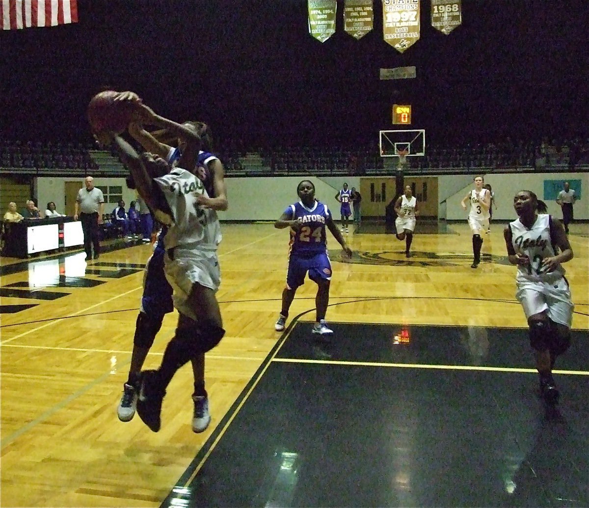 Image: Copeland flies in — Freshman point guard Jameka Copeland(5) survives a Gator attack on her way to the rack.