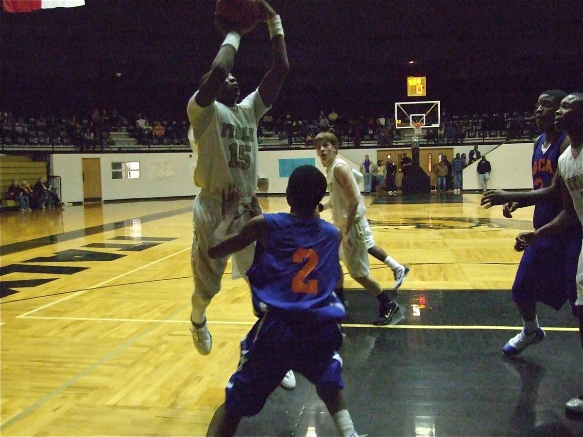 Image: Desmond closes in — Desmond Anderson(15) takes it to the Gator defense.