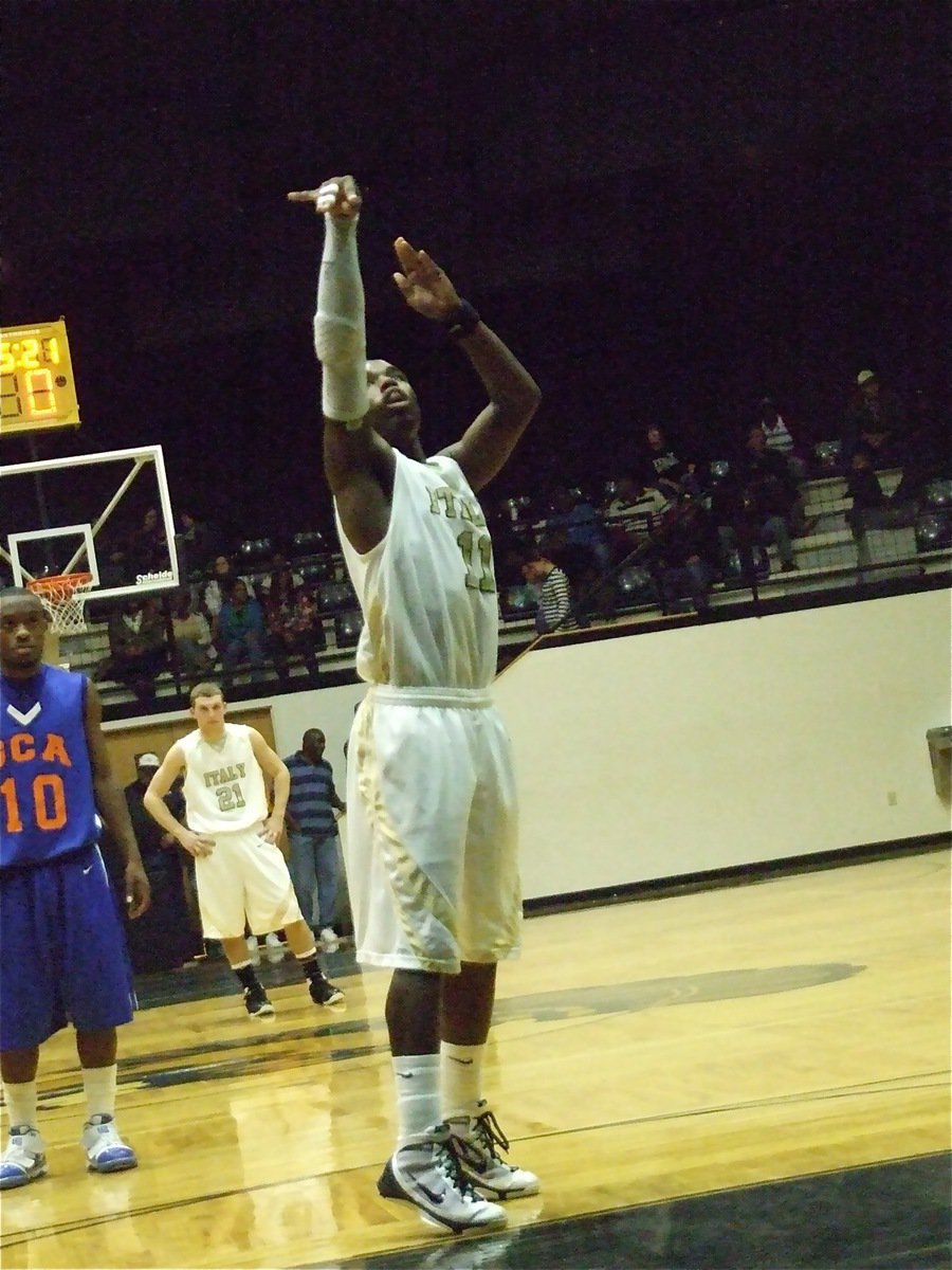 Image: The right touch — Jasenio Anderson(11) gets the job done from the free throw line.