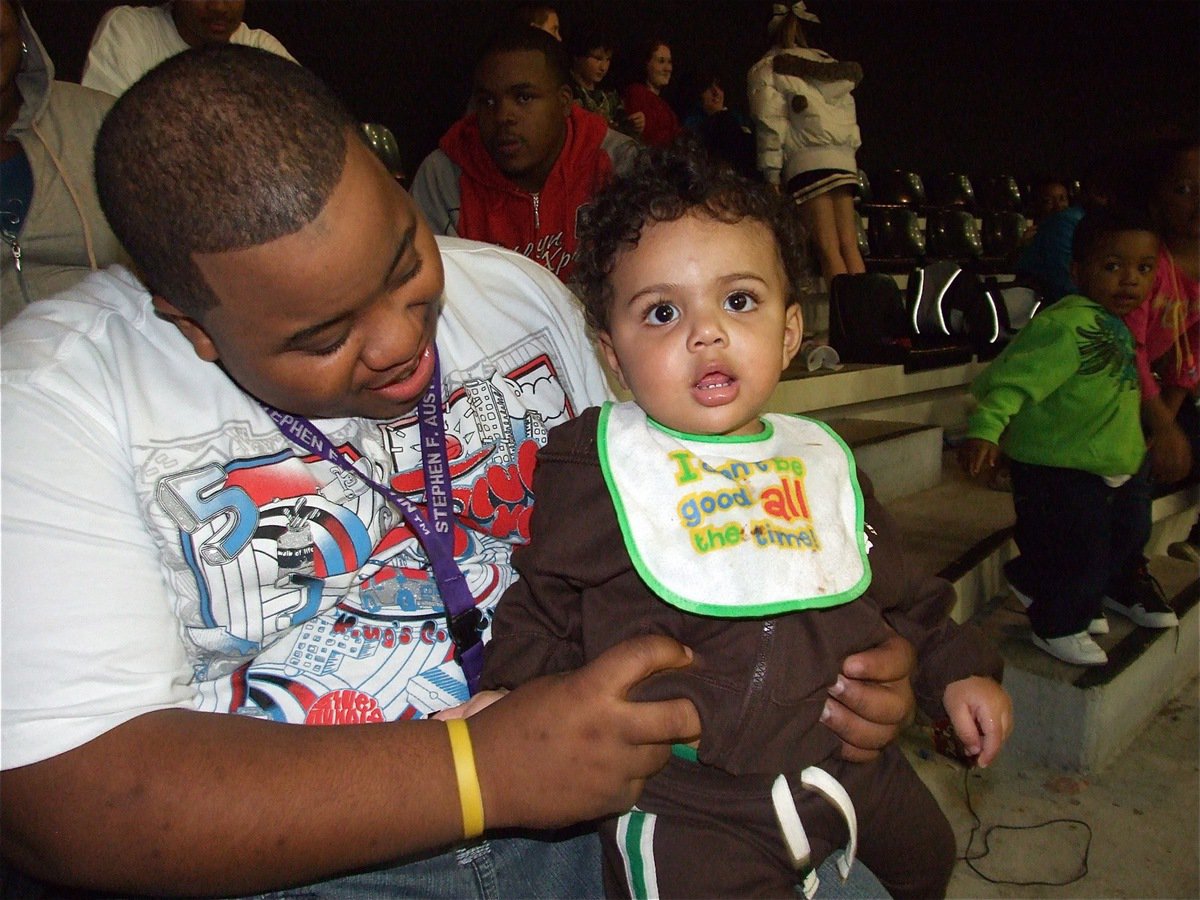 Image: Bouncing baby boy — Cason Green, the son of Alexis Coots and Detrick Green, is having a bouncing good time at the basketball game.