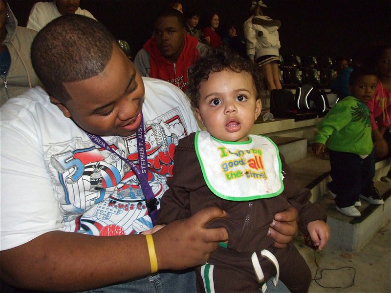 Image: Bouncing baby boy — Cason Green, the son of Alexis Coots and Detrick Green, is having a bouncing good time at the basketball game.