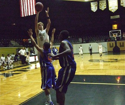 Image: Over the top — Colton Campbell(5) and the Gladiators win over Gateway 88-59.