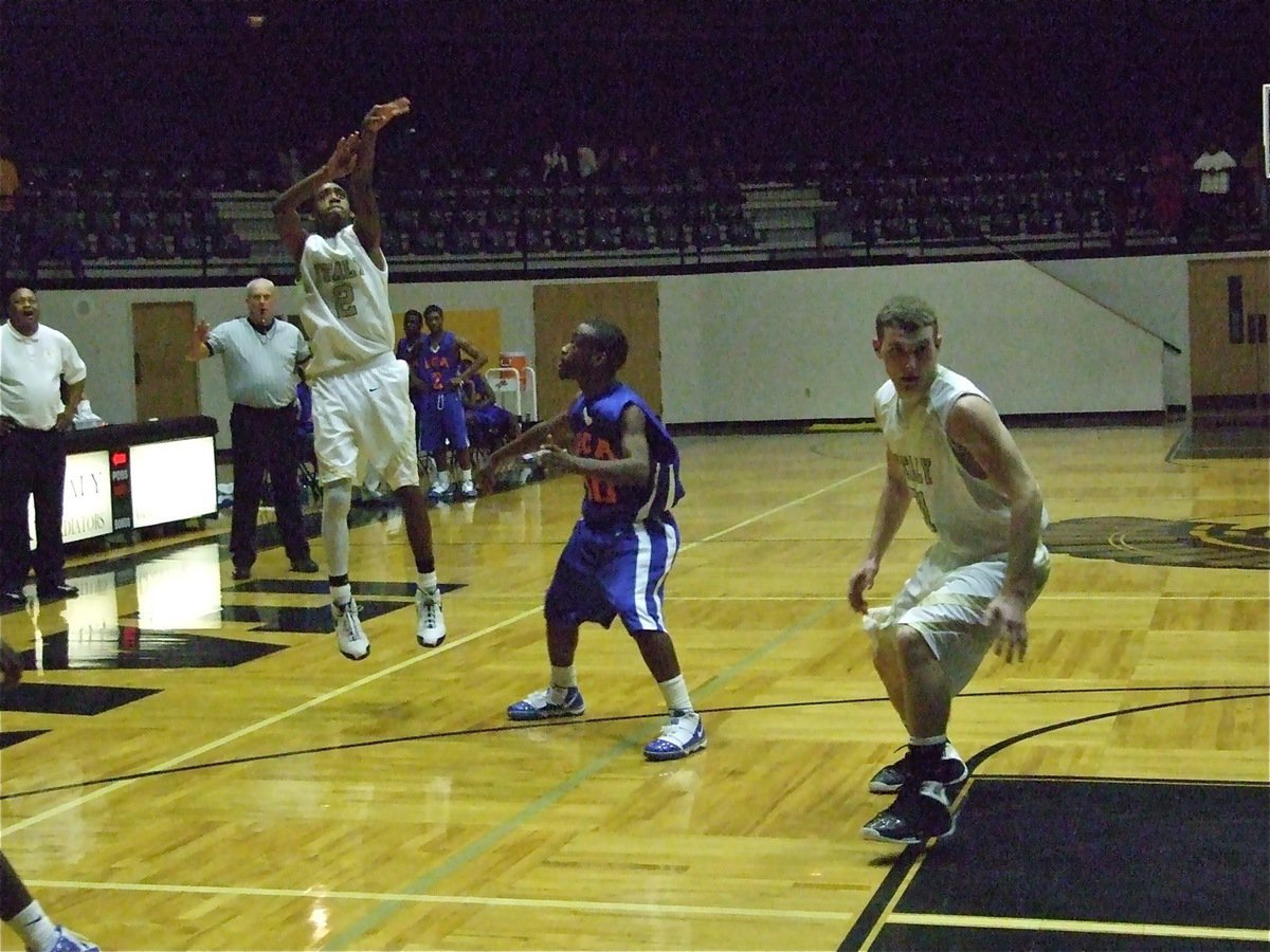 Image: Heath hoops — Heath Clemons(2) shoots the deep ball against a Gator defense that seemed stuck in mud.