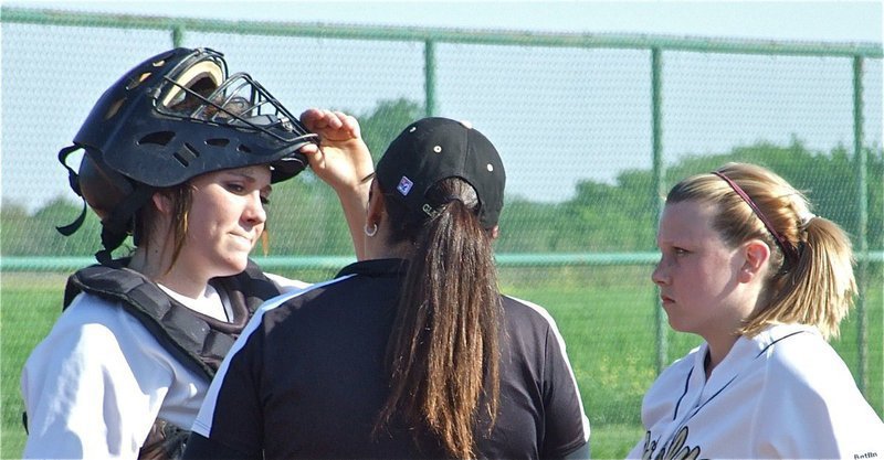 Image: Breyanna Beets and Casi Jeffords talk with Coach Tina Richards — Italy JV Lady Gladiator Softball head coach Tina Richards meets at the mound with catcher Breyanna Beets and pitcher Casi Jeffords during their battle with the Waco Reicher JV Lady Cougars on Monday.
