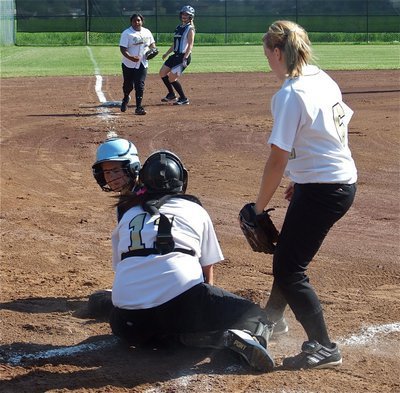 Image: Play at the plate — Italy’s JV pitcher Casi Jeffords tries to lend assistance as catcher Breyanna Beets tries to block the plate as a Lady Cougar comes sliding in.
