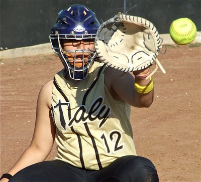 Image: Behind the mask — Alyssa Richards catches a few pitches before the game against Waco Reicher.