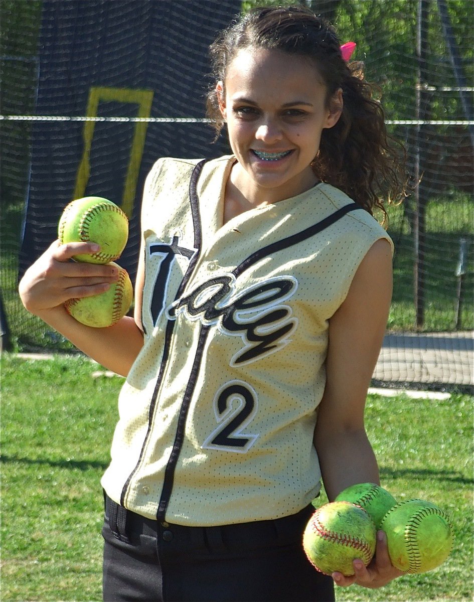 Image: Full count — Anna Viers holds a full count in her hands, 3 balls and 2 strikes.