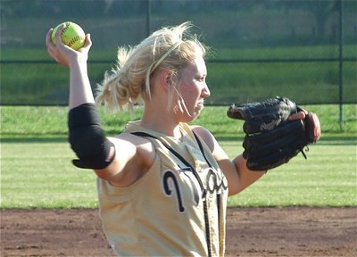 Image: Megan to throw — Third baseman Megan Richards(22) puts a some muscle behind her throws.