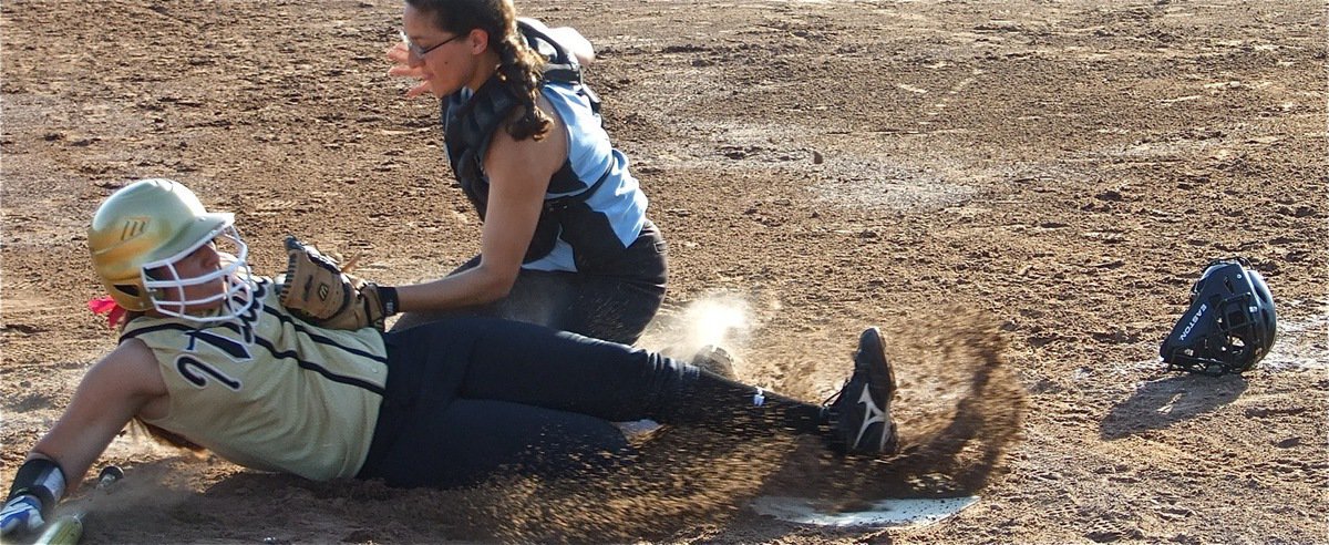 Image: Almost made it — Alyssa Richards tries to slide under the tag but the Lady Cougar catcher makes the play.