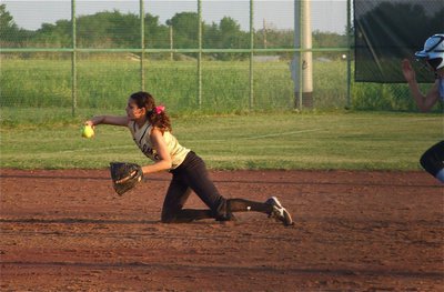 Image: The old flip play — Shortstop Anna Viers(2) flips the ball to third base for a third out.