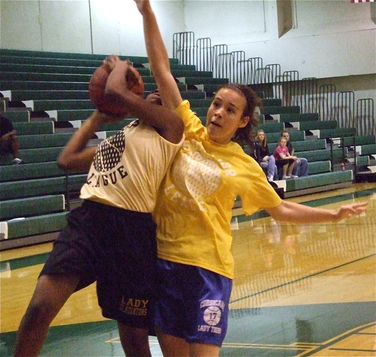 Image: Fouled and-1 — Italy sophomore Jameka Copeland gets fouled hard by a Corsicana Lady Tiger but manages to score the layup.