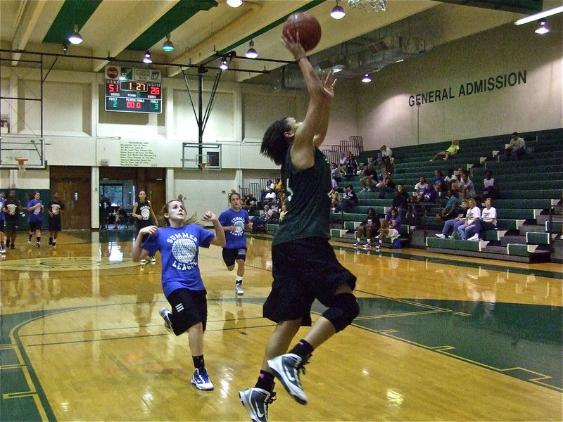 Image: Chanelle Miller — Lady Indian Chanelle Miller, a senior next season for Waxahachie, puts in one final basket against Midlothian.