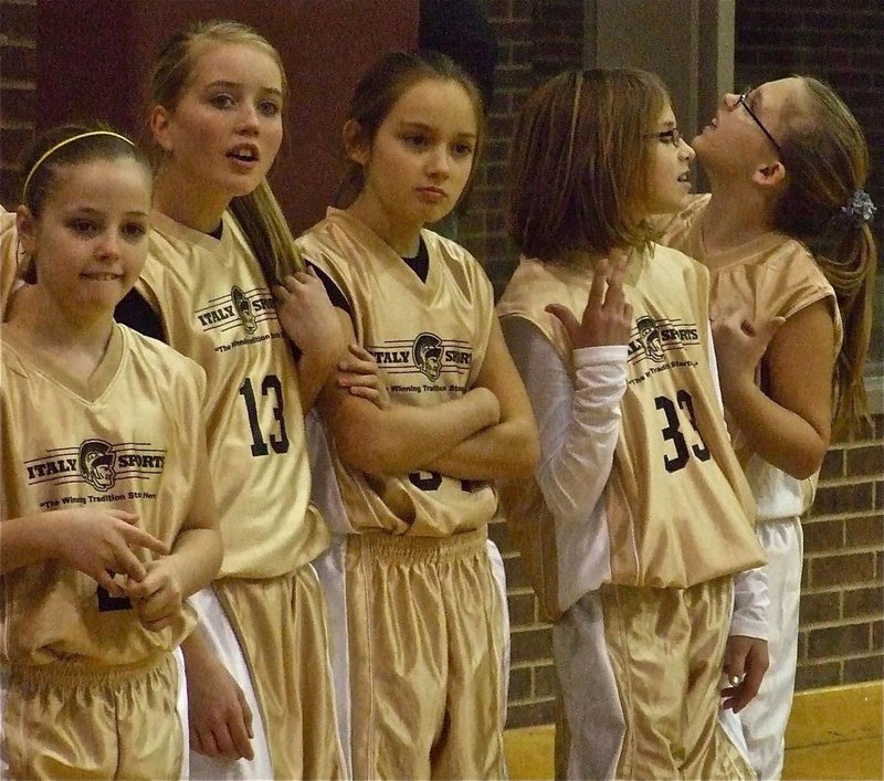 Image: Nervously waiting — Peyton Henderson, Hannah Washington, Halee Turner and Jennifer McDaniel seem a bit nervous before the game.