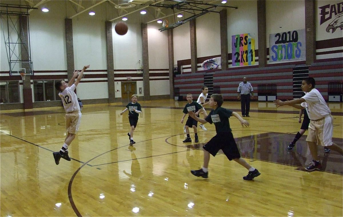 Image: Ty pops the 3 — Ty Windham makes a 3-pointer over Hillsboro Green.