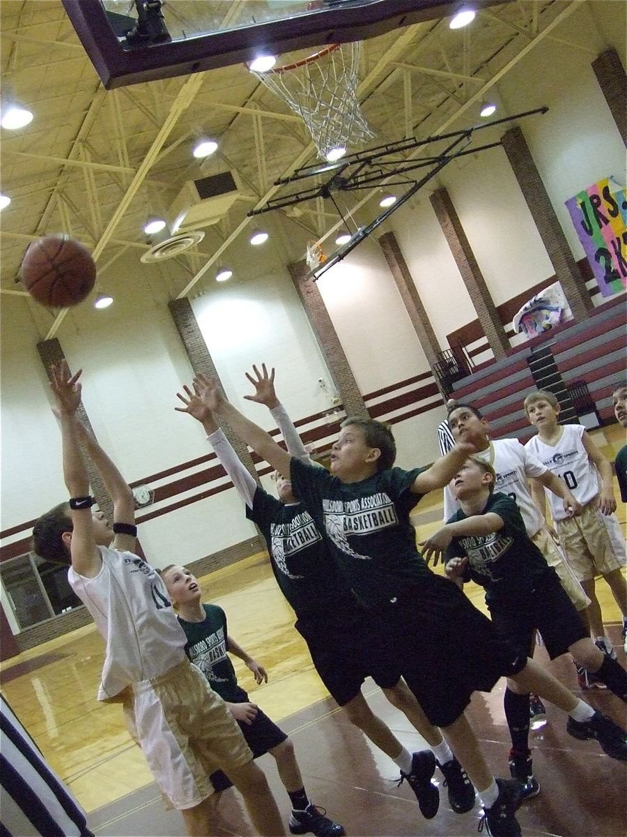 Image: Ryan shoots — Ryan Connor scores from the right block against Hillsboro.