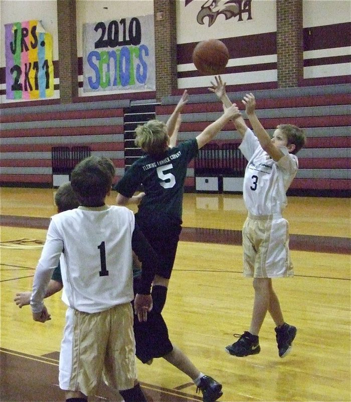 Image: James scores — James Walton(3) knocks down a baseline jumper.