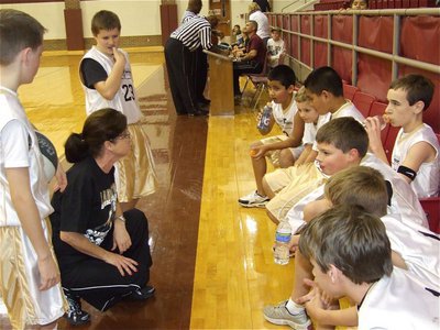 Image: Coach Windham talks — Coach Andrea Windham gives a few pointers to the team during a timeout.