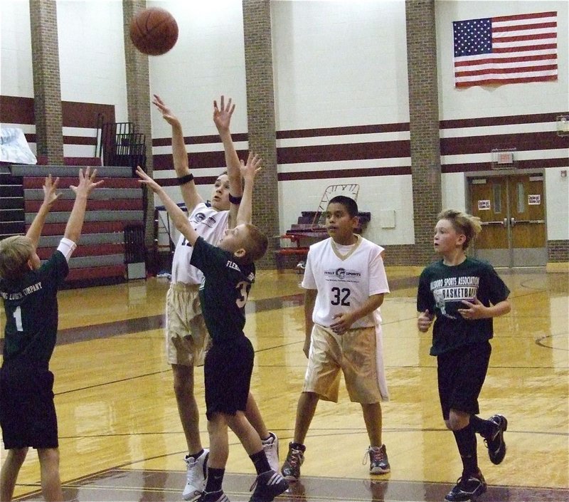 Image: Connor connects — Ryan Connor shoots in the paint as David DeLaHoya(32) has his back.