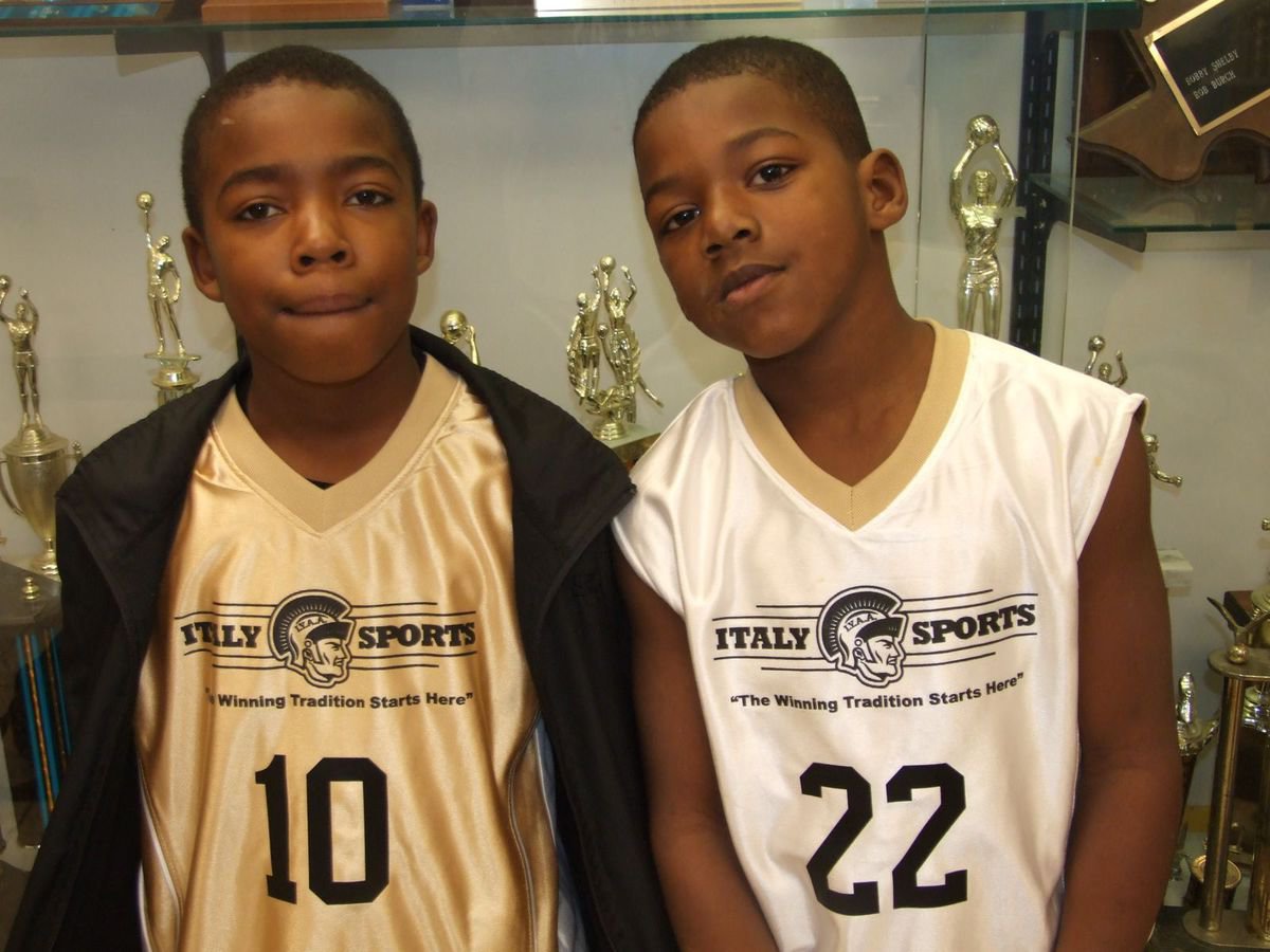 Image: Rising stars — Kendrick Norwood(10) and Ricky Pendleton(22) pose in front of the trophy case inside the old Italy gym.