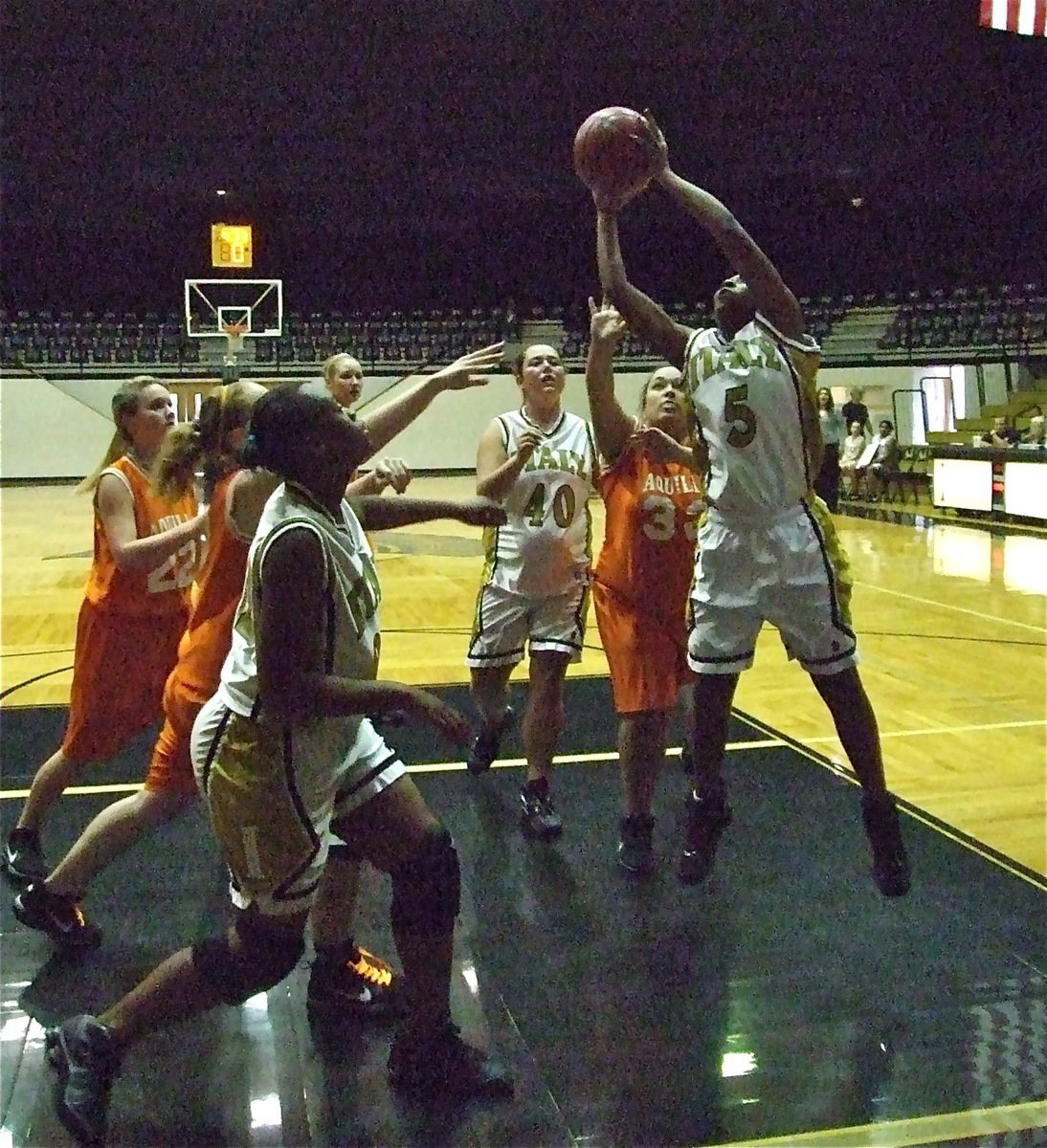 Image: Can’t stop Chante — Chante Birdsong(5) scores 2 of her 17-points against Aquilla as Nikki Brashear(40) and Brianna Burkhalter(22) move in.