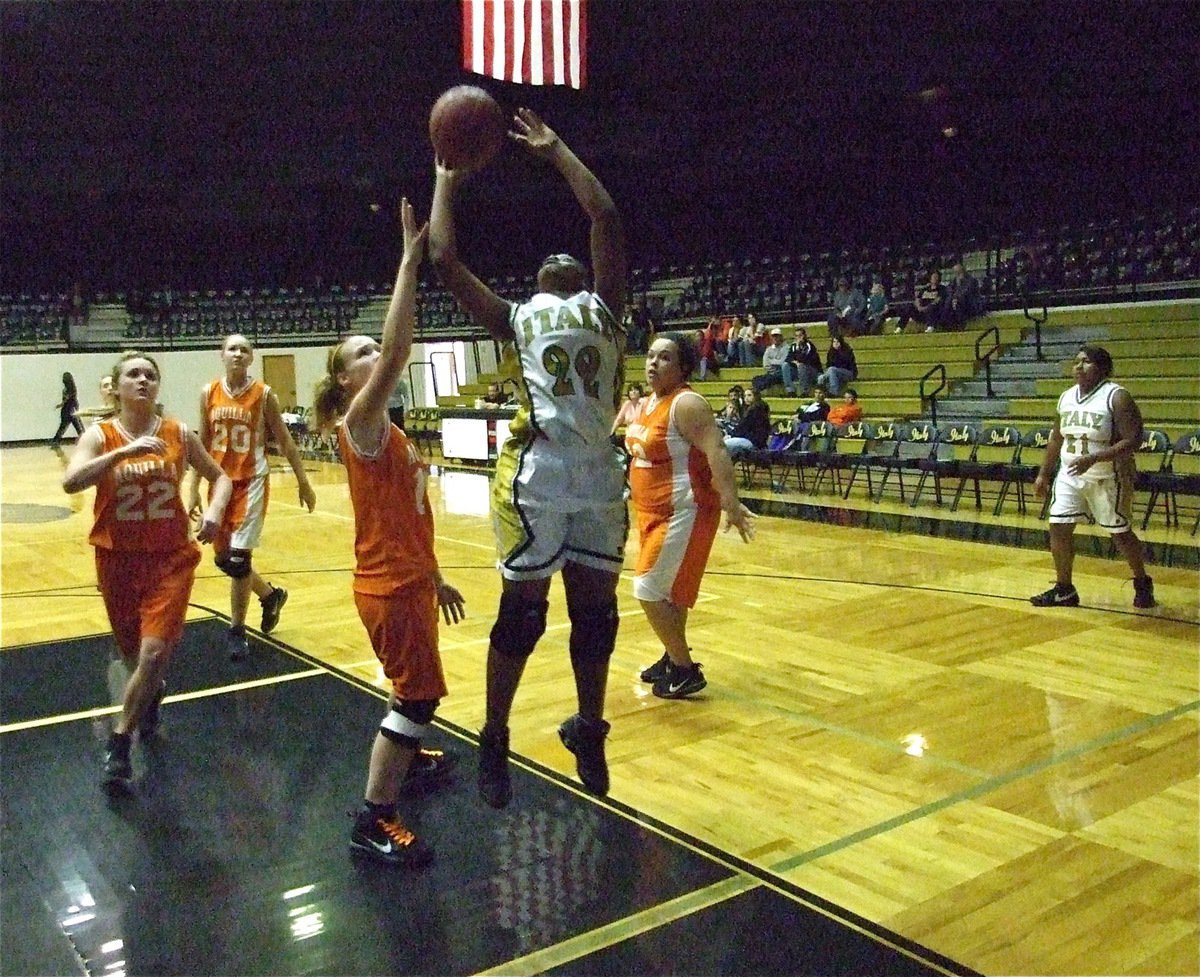 Image: Burkhalter banks one — Brianna Burkhalter(22) scores inside against Aquilla.