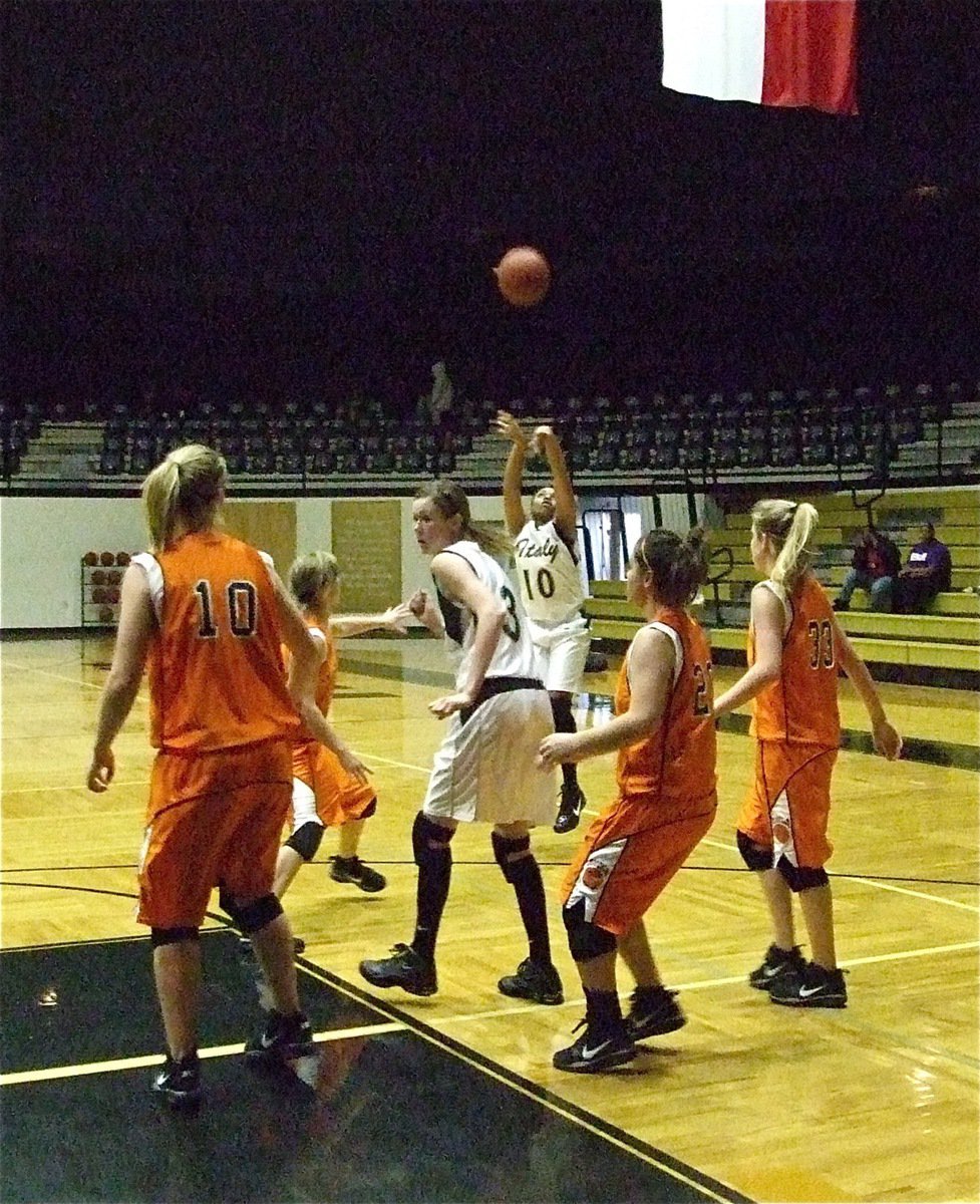 Image: Birthday Girl scores — Kyonne Birdsong celebrates her birthday by swishing a 3-pointer over the Aquilla Lady Cougars.