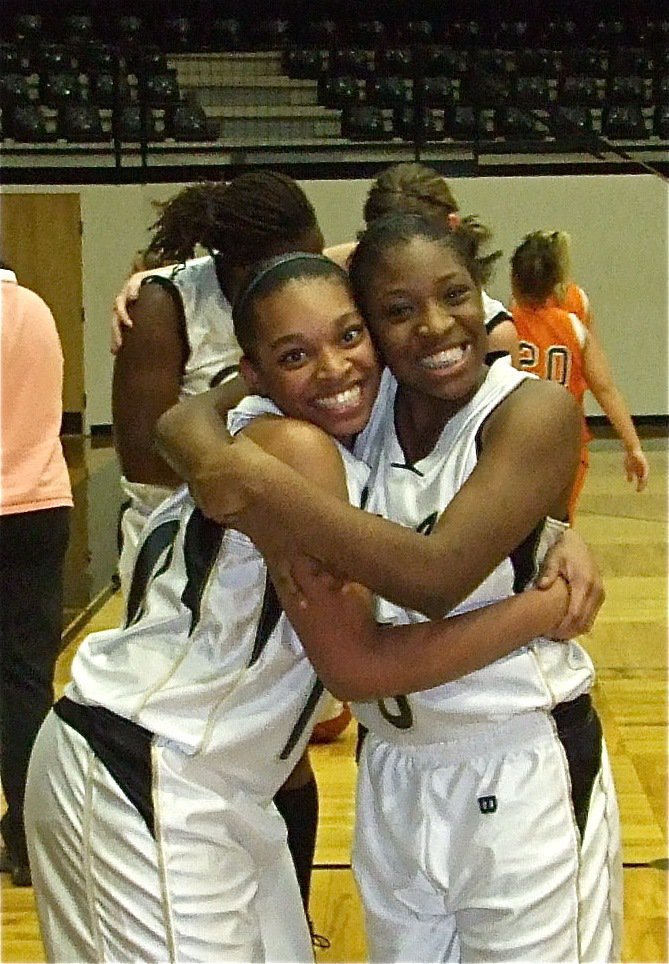 Image: Happy Birthday! — Italy’s Kyonne Birdsong(10) (on the left) gets congratulations for swishing a 3-pointer on her birthday from teammate Jameka Copeland(5) after the game.