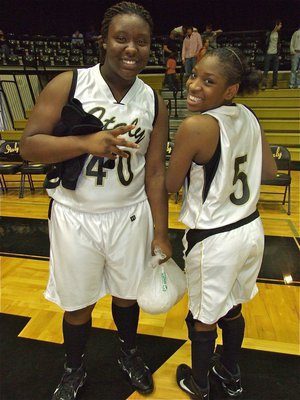 Image: Sugar, spice and ice — Even though she had to take an early exit from the game to ice her knee, Italy’s Jimesha Reed(40) was happy that her teammates finished strong and shared a smile with Jameka Copeland(5) afterwards.