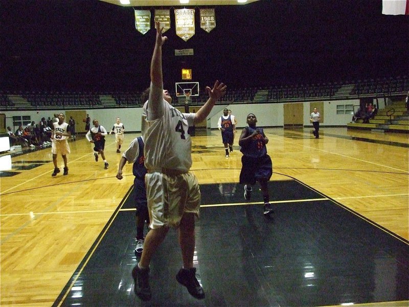 Image: John lays it in — John Byers(44) scores the final 2-points for the 7th grade Gladiators.