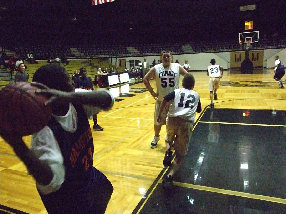 Image: Get back! — A Hampton Prep player prepares to send the ball down court as Italy’s defense scrambles to get back.