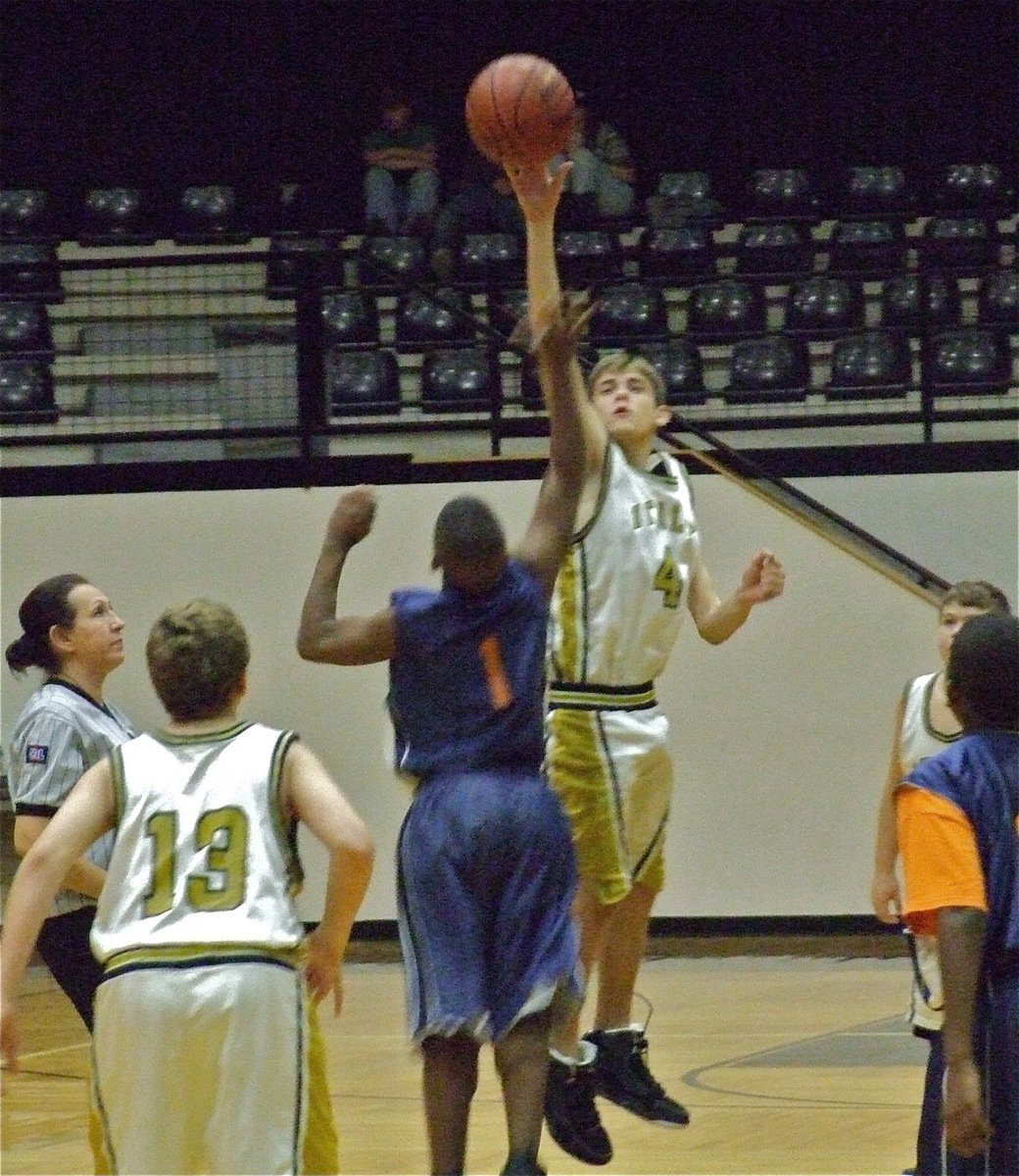 Image: Justin just jumps — Bailey Walton(13) watches as Justin Wood(4) wins the tip for Italy but Hampton Prep won the game.