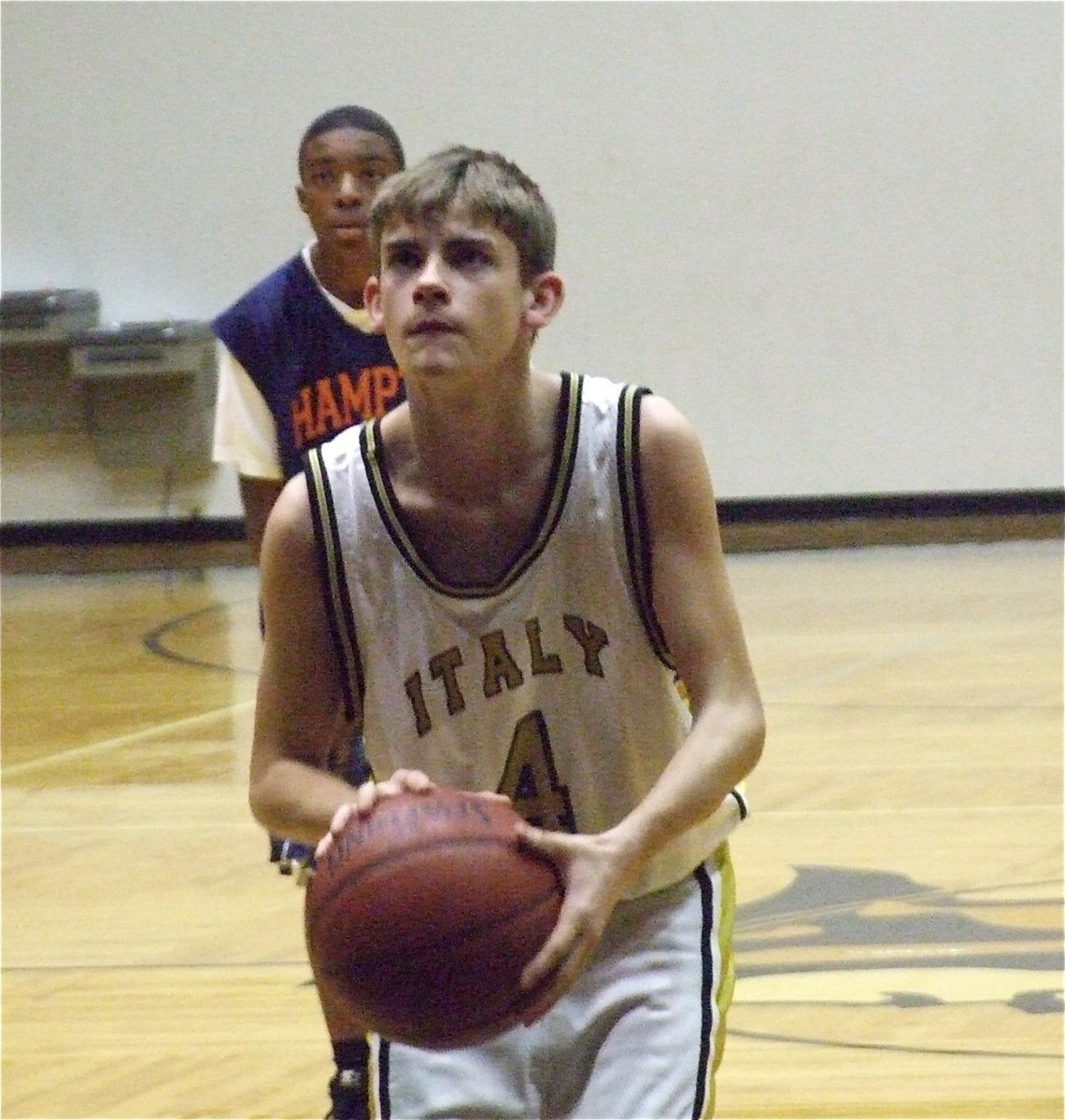 Image: Justin shoots a freebie — Justin Wood(4) concentrates during his free throw attempt.