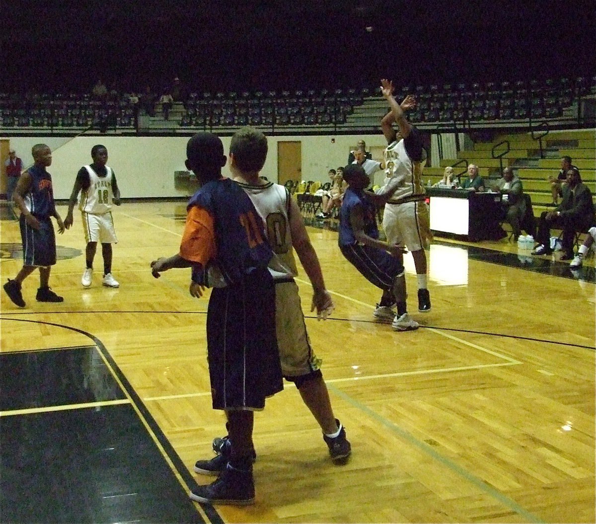 Image: Darol makes a three — Darol Mayberry(3) knocks down a 3-pointer against Hampton prep.