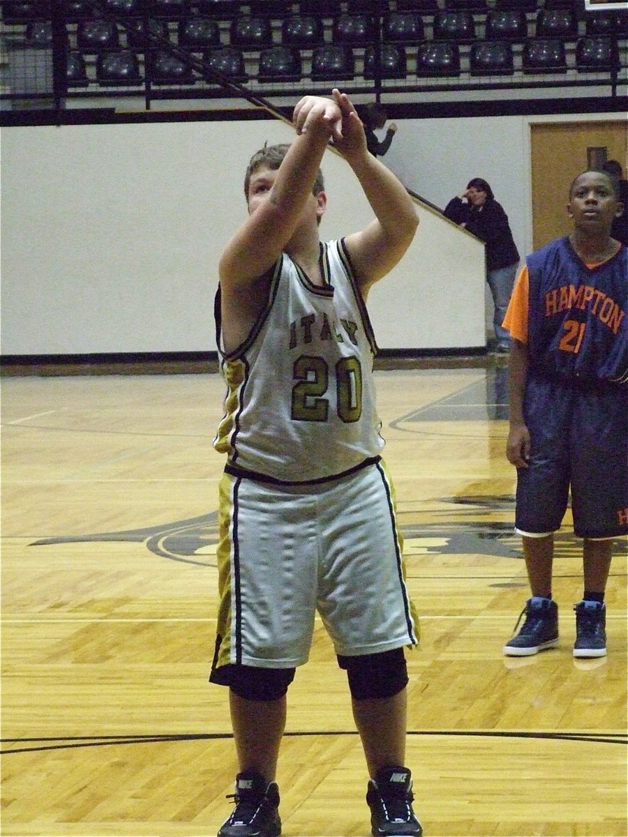 Image: Zain eyes it in — Zain Byers(20) hit 2-of-4 free throws during the matchup with Hampton Prep.