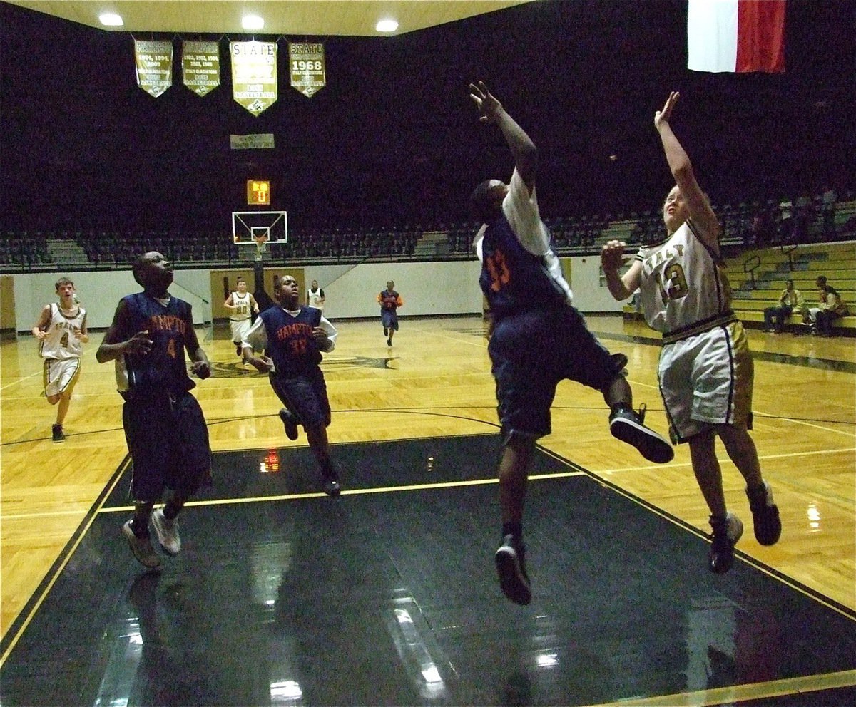 Image: Bailey on the fast break — Bailey Walton(13) tries to bank one in over a Pheonix defender.