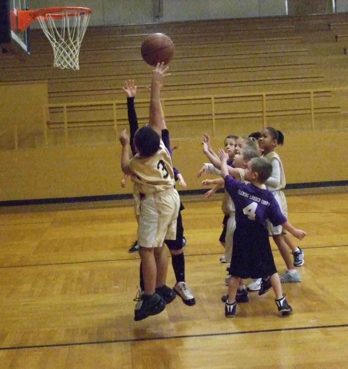 Image: Cornelius shoots — Cornelius Jones(3) puts up a shot over a Hillsboro Purple defender.