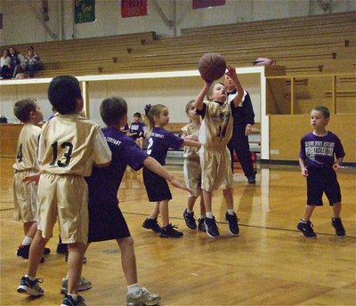 Image: Reese goes up — Reese Janek(14) puts up a shot against Hillsboro Purple.