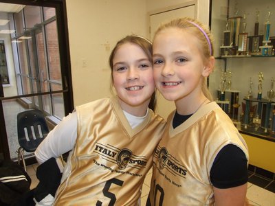 Image: Grace and Annie — Italy 14 teammates Grace Haight(5) and Annie Perry(10) get excited about their game.