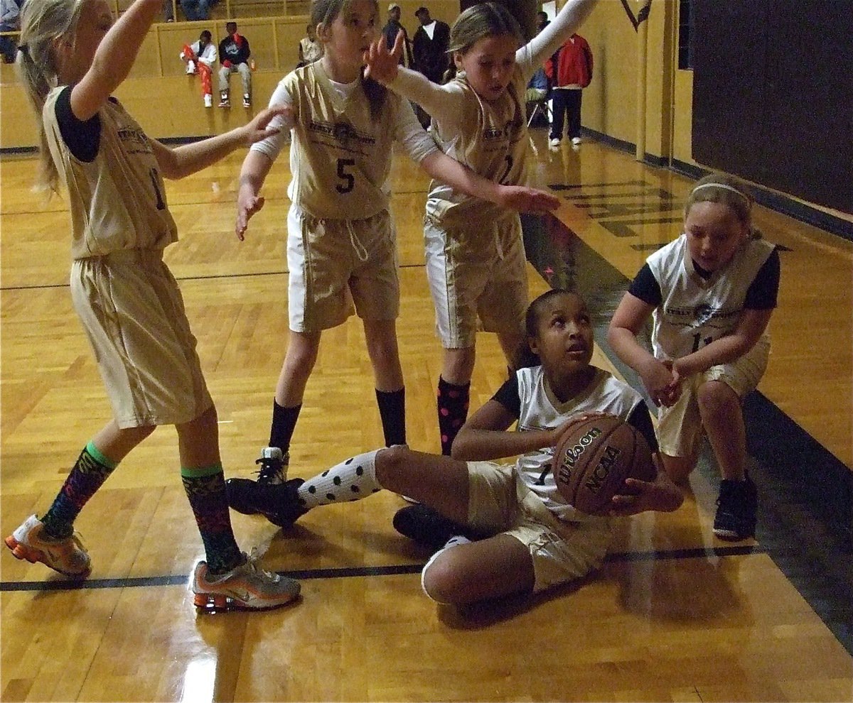 Image: Emily gets dirty — Emily Cunningham(1) dives on the floor to control the ball as teammate Brycelen Richards(11) sneaks in to help. Annie Perry(10), Grace Haight(5) and Hannah Haight(2) of Italy 14 have them surrounded.