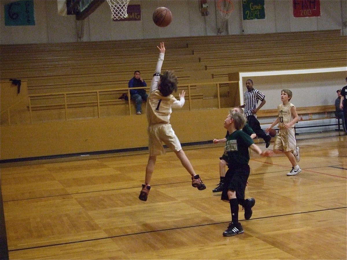 Image: Levi scores — Levi McBride(1) finishes the fast break against Hillsboro Green and scores 2-points.