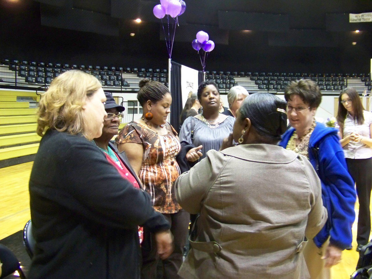 Image: Moment with family — Moreland accepts congratulations from family and co-workers.