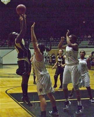 Image: Reed unleashes — Showing excellent form from the low block is Lady Gladiator center Jimesha Reed(40).