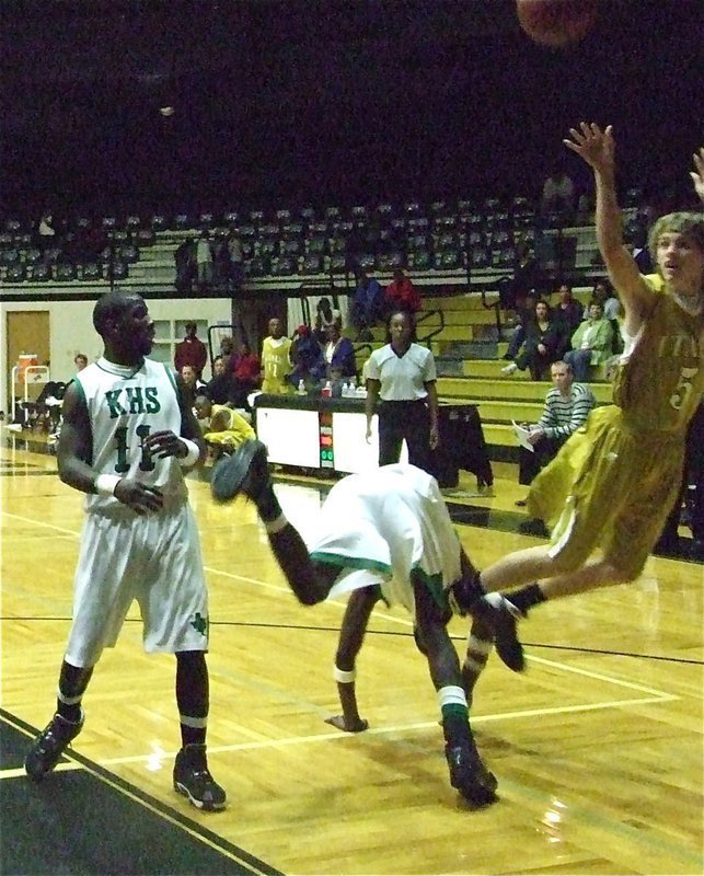 Image: Gotcha! — Italy’s Colton Campbell(5) gets fouled while shooting over the Bobcats.